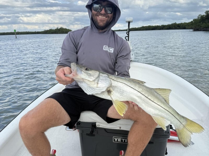An angler on the back of the boat in Marco Island, Florida