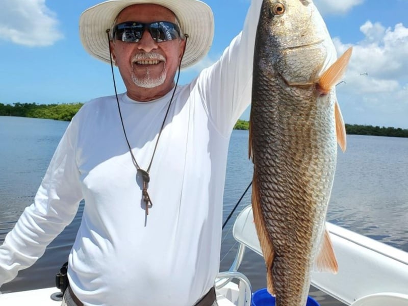 A fisher with his catch from Captain Rio Adventures