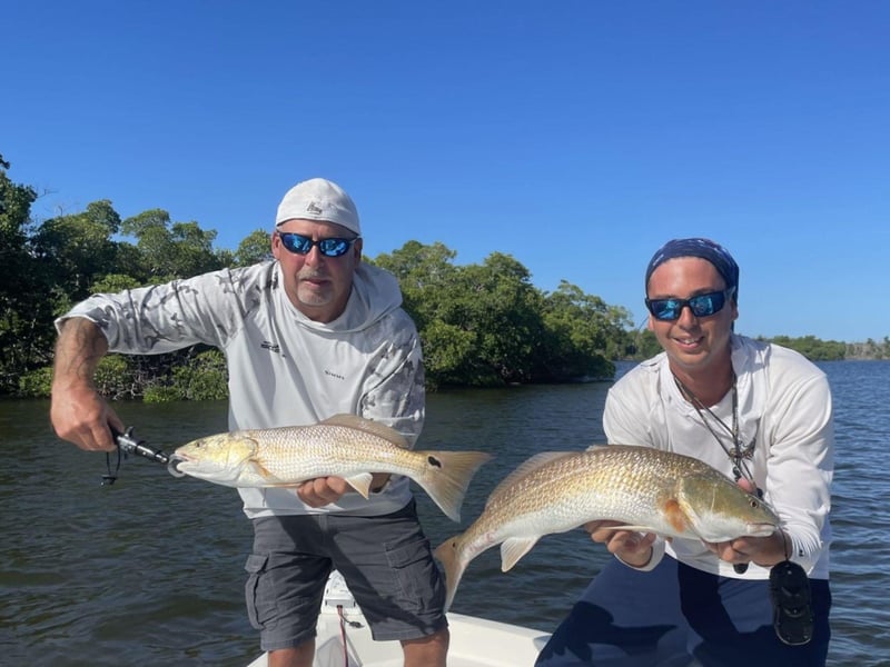 Captain Josh and a guest with their fish