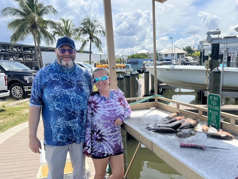Anglers with their fish on the dock