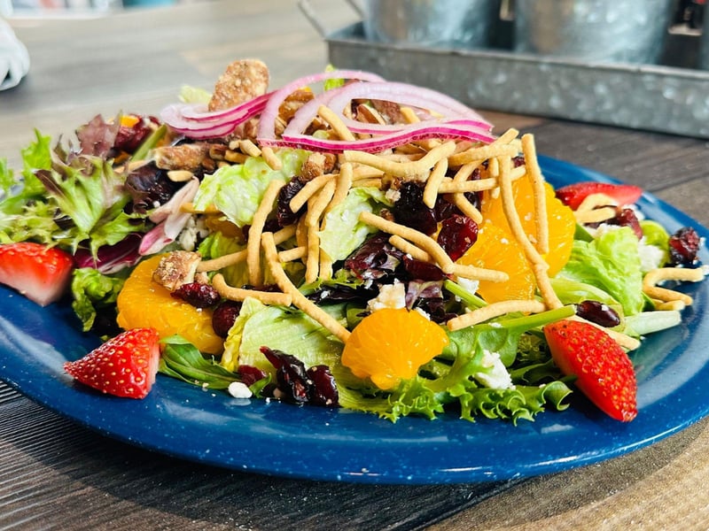 The summer salad with a raspberry pecan vinaigrette