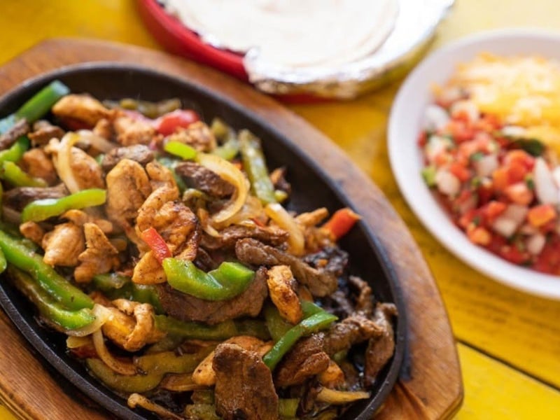 Half chicken and half steak fajitas