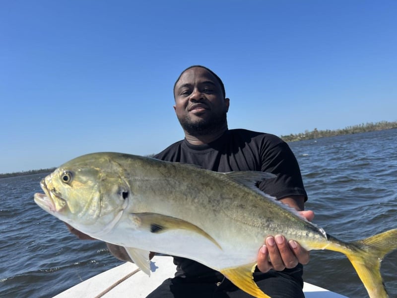 A guest showing off his catch on the boat