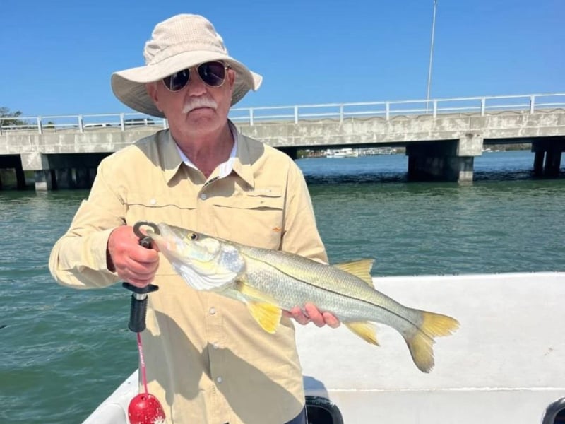 An angler showing off his catch