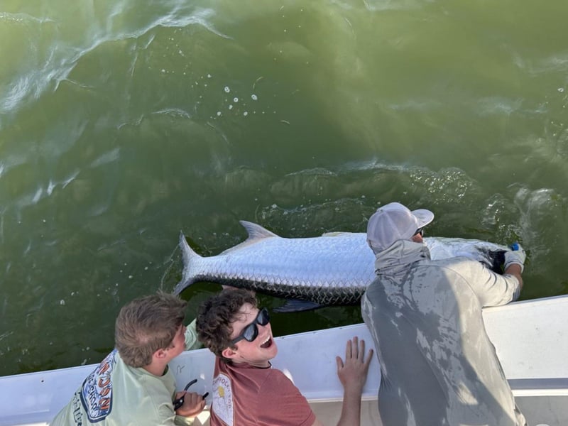 A group fishing with Thrill Of It All