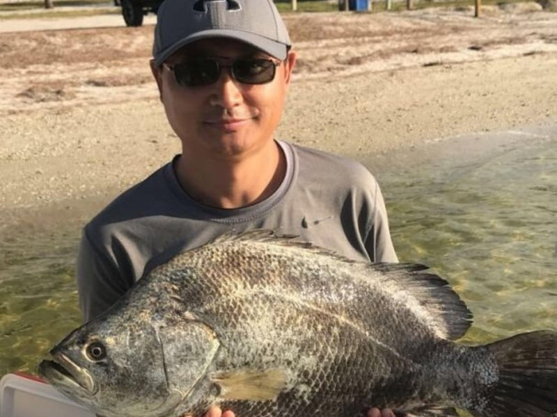 An angler with his fish on the boat