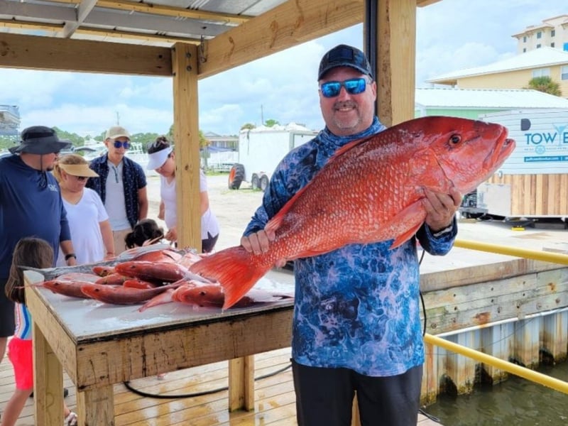 A guest showing off his giant Red Snapper