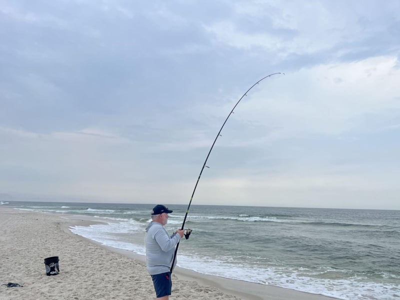 An angler fishing on the beach in Perdido Key, Florida