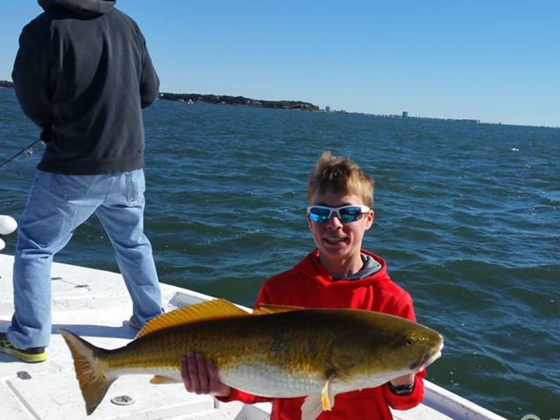 A child on board Emerald C Fishing Charters in Perdido Key, Florida