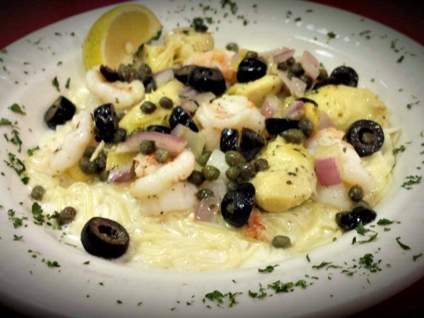 platter of shrimp, artichokes, olives. and pasta from Francos Italian restaurant in Orange Beach, AL