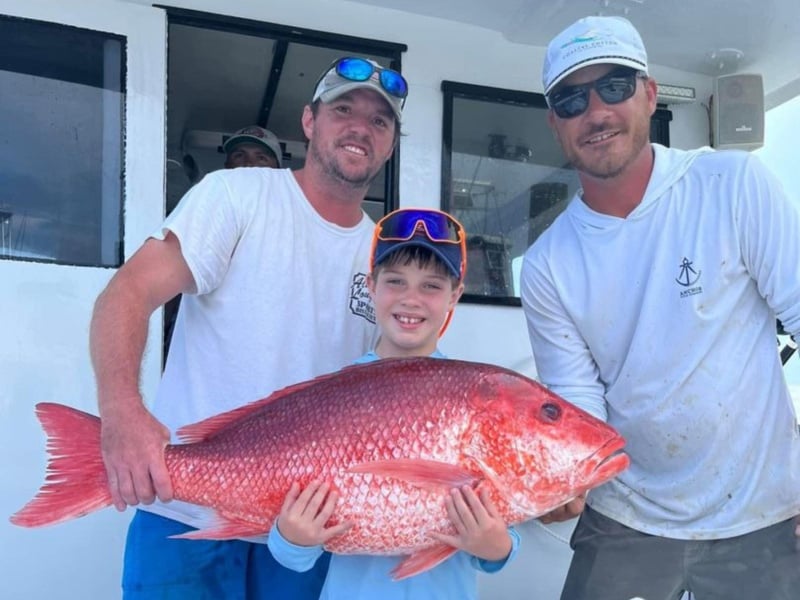 Anglers with their large red snapper from Boll Weevil