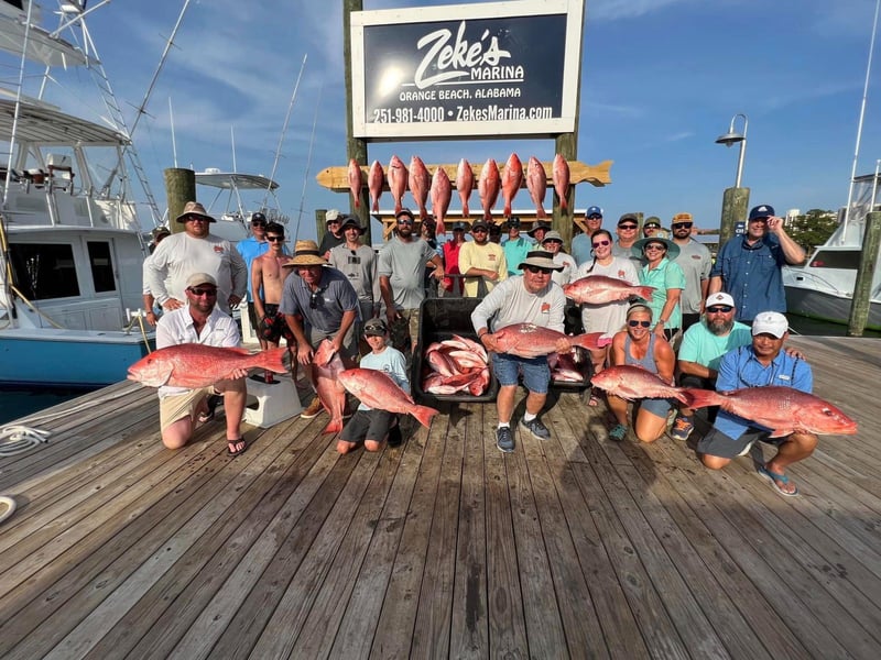 A group on the dock with their catch from Shady Lady Charters in Orange Beach, Alabama