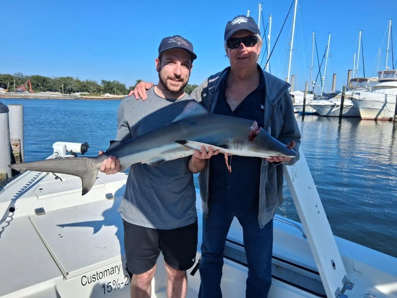 A man with his shark off the coast of Florida