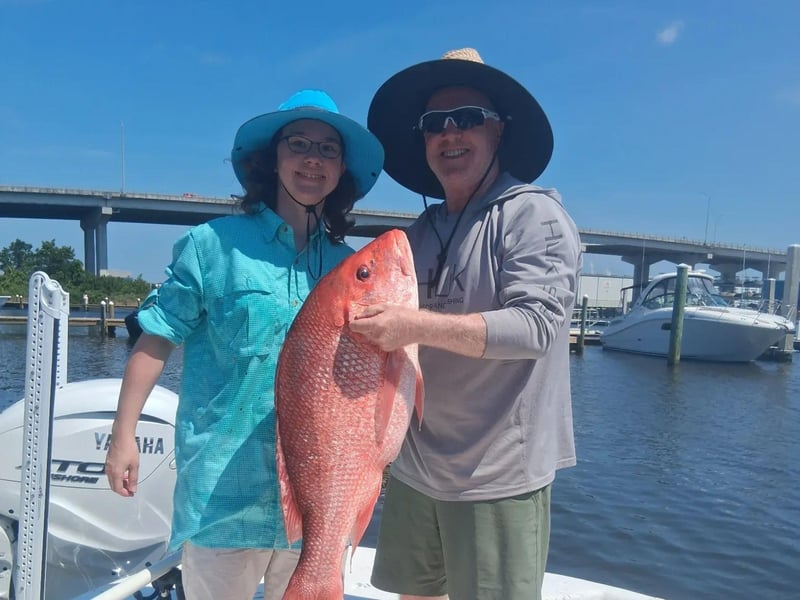 An angler showing off his red snapper