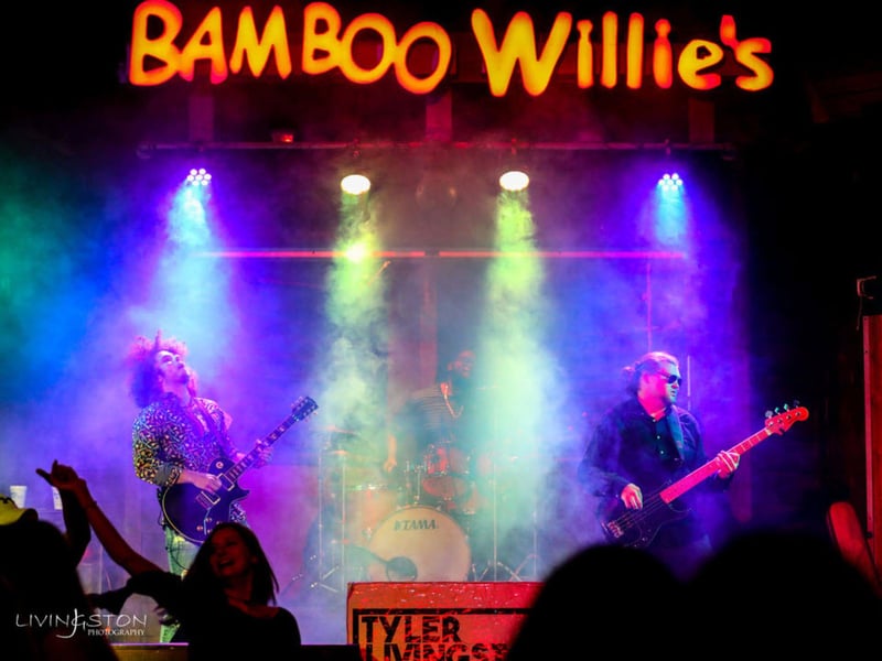 A band on stage at Bamboo Willies Beachside Bar in Pensacola Beach, Florida