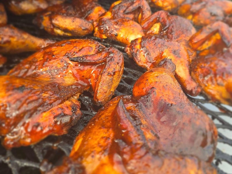 Half smoked chicken on the grill at Half Shell Dockside