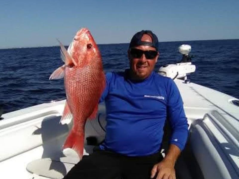 A man with his catch on Captain Js Charters