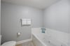 Primary bath offers a tub with jets for some relaxing soak therapy.