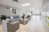 Huge Lobby with Fitness Center exits to large waterfront pool area.