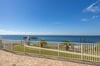 A huge pool deck with a view of the marina and a whole lot of natural beauty.