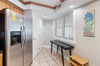 Fully equipped kitchen with washer  dryer closet.