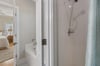 Primary bath is en suite with a separate shower and a soaking tub.
