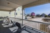 Relax on the covered deck and enjoy Gulf views with easy beach access just across the street