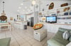 Open layout connects kitchen, dining, and living areas—great for groups and families