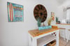 Relaxed coastal living space with easy flow into the kitchen and dining areas