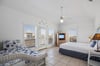 Bright and inviting guest bedroom with cozy coastal touches