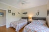 Another angle of the guest room—comfortable setup with easy access to its own private bathroom