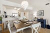 Seating for 7 guests in dining area.