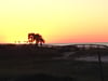 Molokai Perdido Key view of sunset from the deck of a beachside condo