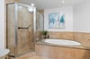 Primary bathroom with walk in shower and soaking tub