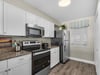 Fully Stocked Kitchen with Stainless Steel Appliances