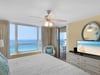 Flat Screen TV in Primary Bedroom with Balcony Access