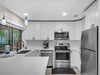 Fully Equipped Kitchen with Pass Through Window to Private Screened Balcony