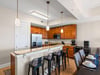 Kitchen provides a breakfast bar where you can enjoy morning coffee together.