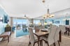 Relax in your spacious oceanfront living area with panoramic sea views, comfortable seating, and elegant dining space perfect for memorable meals.
