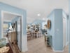 Relax in your coastalinspired retreat with soft blue walls and open living spaces that flow beautifully together.