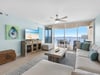 Relax in your bright living space with ocean views and coastal decor, where comfort meets the sea.