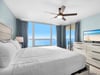 Wake up to endless ocean views from your serene bedroom, where soft blue walls and crisp linens create your perfect coastal retreat.