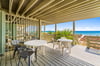 The lower level balcony offers easy, direct access to the beach