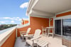 Relax in comfortable Adirondack chairs on this private balcony, where coastal breezes and stunning views create the perfect morning coffee spot.