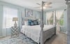 Bedroom 1  Unwind in your elegant fourposter bed beneath a gentle ceiling fan, where coastal blues and crisp linens create the perfect retreat.