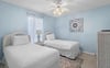 Bedroom 3  Drift off peacefully in your serene twin bedroom with soft blue walls and coastal charm.