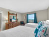 Bedroom 2  Rest comfortably in your double bed bedroom with cheerful turquoise accents and lovely views from your window.