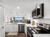 Your dream kitchen awaits with sparkling countertops, stainless steel appliances, and ocean views that make every meal magical.