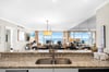 Cook with stunning ocean views from your granite kitchen while enjoying the openconcept design that flows into your beachfront living space.
