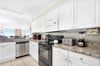 Your fully equipped kitchen features granite counters, stainless appliances, and ocean views—perfect for preparing meals while enjoying the scenery.